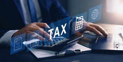 Businessman using the laptop to fill in the income tax online return form for payment.
Financial...