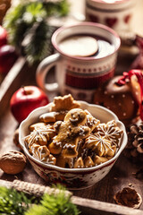 A bowl full of Christmas gingerbread along with hot punch