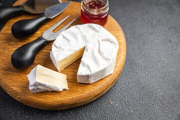 camembert or brie cheese head of soft cheese healthy meal food diet snack on the table copy space food background rustic. top view keto or paleo diet