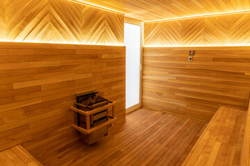 Classic sauna interior in Mexico. Beautiful and clean wooden sauna. Nice modern bathroom for hot spa treatments.