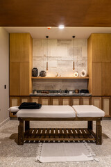 Interior of an empty modern spa massage room.