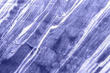 Trendy abstract natural stone background. Toned in trendy color of year 2022. Elegant marble texture background. Closeup. Soft light background for decorative design.