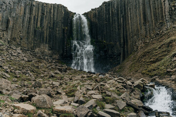 waterfall in Green River Through Studlagil basalt canyon, Iceland