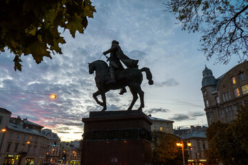 Monument to the first Ukrainian king Danil on Halytska Square against the background of evening...