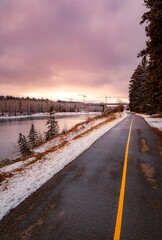 Park Walkway By The River At Sunrise