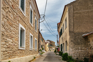 Fototapeta na wymiar Old narrow street in Lefkimmi, Corfu, Greece.