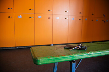 abandoned and lost house and car keys in the gym locker room, front and background blurred with bokeh effect