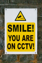 Smile you are on CCTV sign