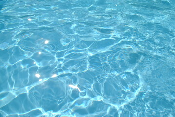 Solar glare on the water in the pool.blue