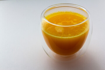 fresch orange juice in glass on white background, healthy eating, copy space, horizontal