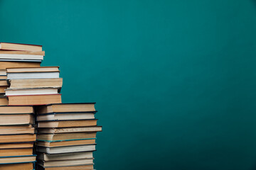 educational books for studying in the university library on a green background