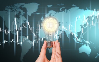 Cryptocurrency concept. Businessman holding iluminated light bulb with bitcoin icon.