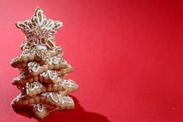 New Year. cookies lined with a Christmas tree on a red background