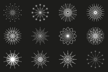 A set of 12 white snowflakes on a dark gray background. A gentle symbol of winter. Openwork winter patterns.