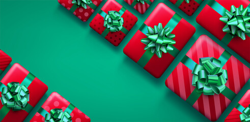 Christmas red gift boxes on green background.
