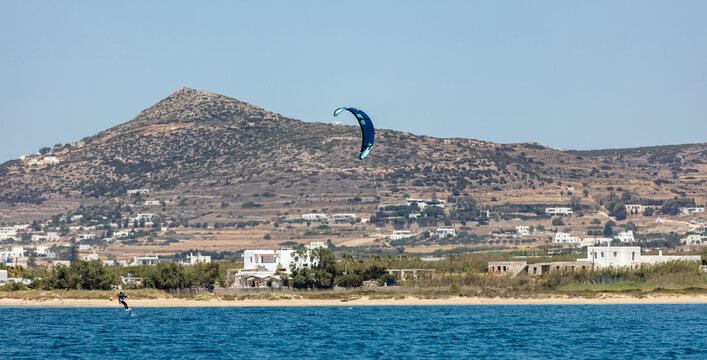 Kitesurfing kiteboarding in Aegean sea at Pounta beach, Paros island Cyclades destination Greece.
