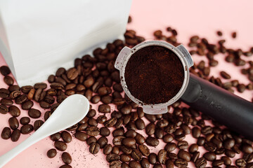 Macro White Foil Coffee Bean Bag Mock Up with Coffee Beans with White Spoon and PortaFilter on Pale Pink Background Valentine's Day