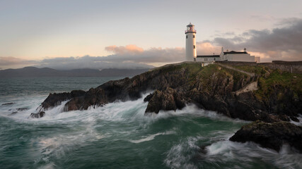 Fototapeta na wymiar Fanad Rough Seas. Fanad Lighthouse situated in Co Donegal, Ireland. One of the country's most famous lighthouse dating back over 200 years undisturbed by the battering from the Atlantic Ocean.