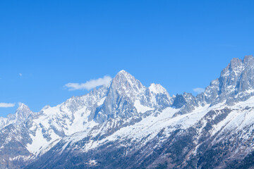 The panoramic view of the Aiguille Verte and the Aiguille du Dru in the Mont Blanc massif in Europe, France, the Alps, towards Chamonix, in spring, on a sunny day.