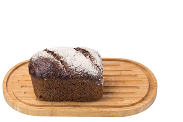 Close up  view of whole grain loaf rye bread  on a cutting board isolated on white background. 