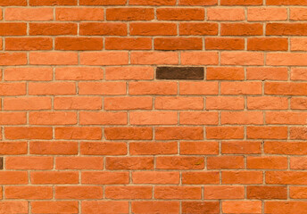 red brick wall with one brown brick highlighted, texture for background