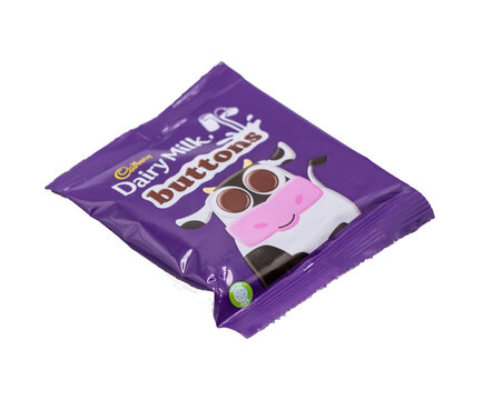 Norwich, Norfolk, UK – December 2021. Close Up And Selective Focus Of A Packet Of Cadbury Buttons Chocolate Cut Out Isolated On A Plain White Background. A Multi Pack Product Not For Single Sale.