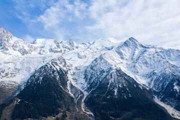 The snow-capped Mont Blanc massif in Europe, France, the Alps, towards Chamonix, in spring, on a sunny day.