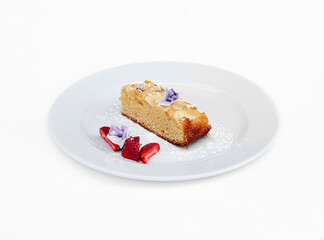 Plate with sweet dessert on white background