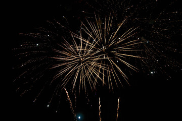 Very beautiful fireworks against the black sky. Graphic resource for design. Underlay or undercoat