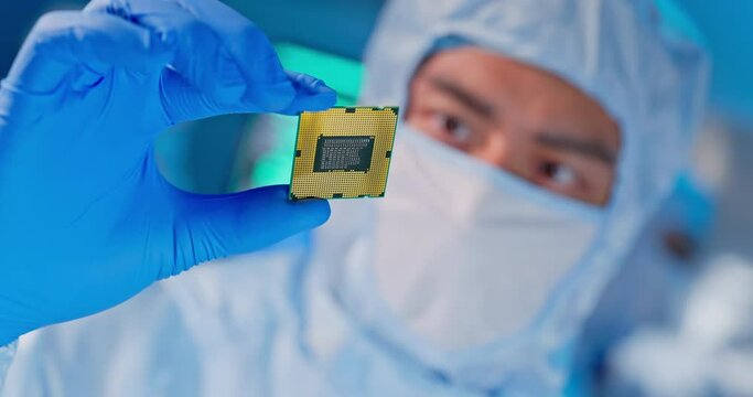 engineer holds microchip