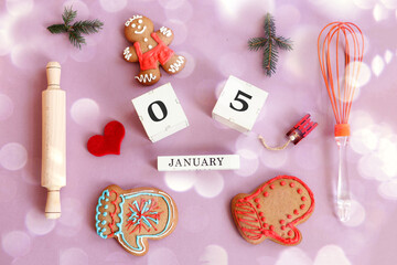 Calendar for January 5: name of the month in English, cubes with numbers 0 and 5, gingerbread men,...