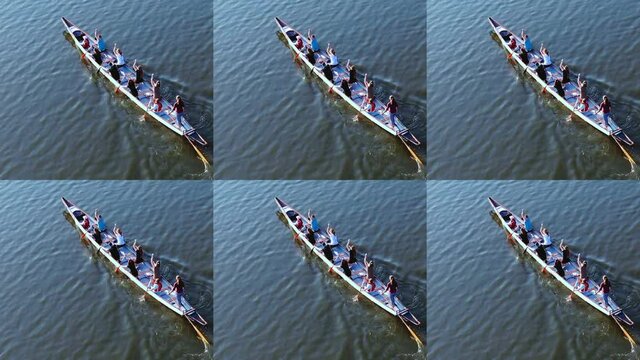 Aerial drone top view of sport canoe rowing team of athletes competing 