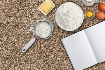 New Year in the kitchen.  A piece of dough, eggs and a wooden rolling pin lies on a granite countertop