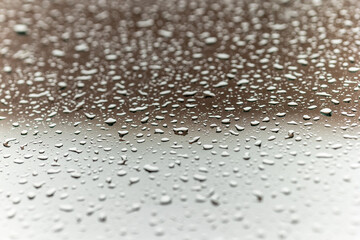 raindrops on the glass. abstraction and a beautiful background, free space for text or a place for an advertising inscription. photo of the window after the rain. weather forecast and rains with snow