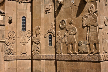 Bas-reliefs on exterior walls of Church of the Holy Cross (Cathedral of the Holy Cross) (Akdamar Kilisesi) on Akdamar Island, Lake Van, Eastern Anatolia, Turkey. David and Goliath are on the right.