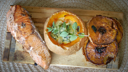pumpkin with vegan cheese sauce whit salmon fish. squash with cashew cheese