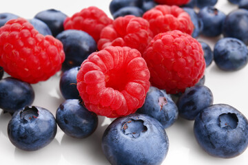Tasty ripe berries on white background, closeup