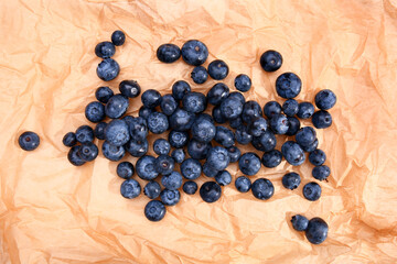 Tasty ripe bilberries on parchment
