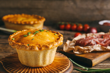 Tasty beef pot pie on table