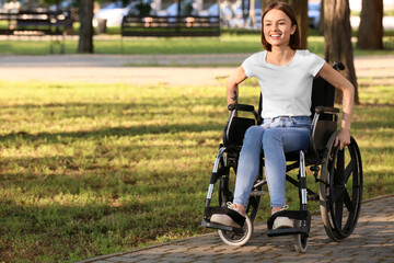 Young woman with physical disability in park