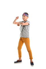 Dancing little boy isolated on white
