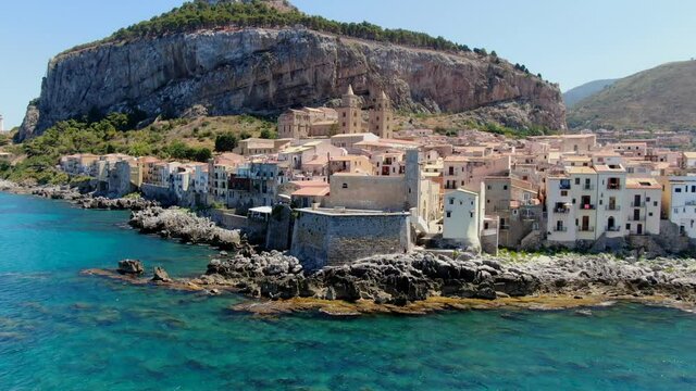 Cefal&ugrave;, Sicily. Drone flyaway from the city keeping the duomo in sight.