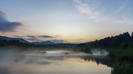 Naklejka na ściany i meble sunset at beautiful river landscape with fog, Croatia