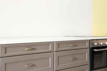 Modern kitchen drawers in light room