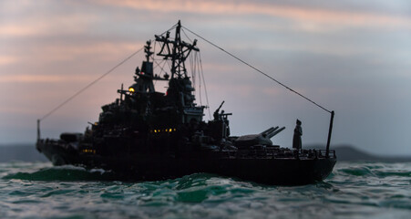 Silhouettes of a crowd standing at blurred military war ship on foggy background. Selective focus.