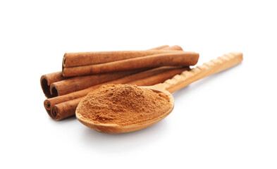 Spoon with natural cinnamon powder and sticks on white background