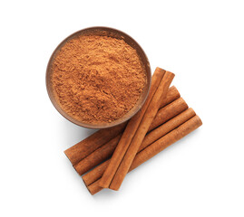 Bowl with natural cinnamon powder and sticks on white background