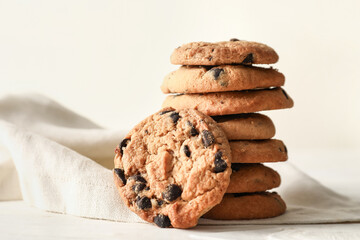 Tasty homemade cookies with chocolate chips on table, closeup