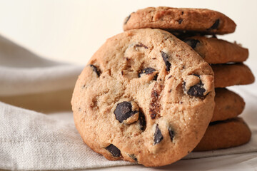 Tasty homemade cookies with chocolate chips on table, closeup