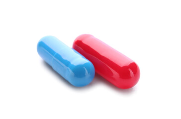 Blue and red pills on white background. Concept of choice